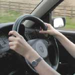 driving school pupil at steering wheel